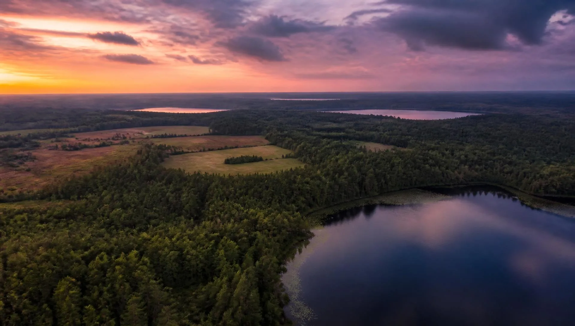 Aerial view of Florida lakes, forest and open land at dusk